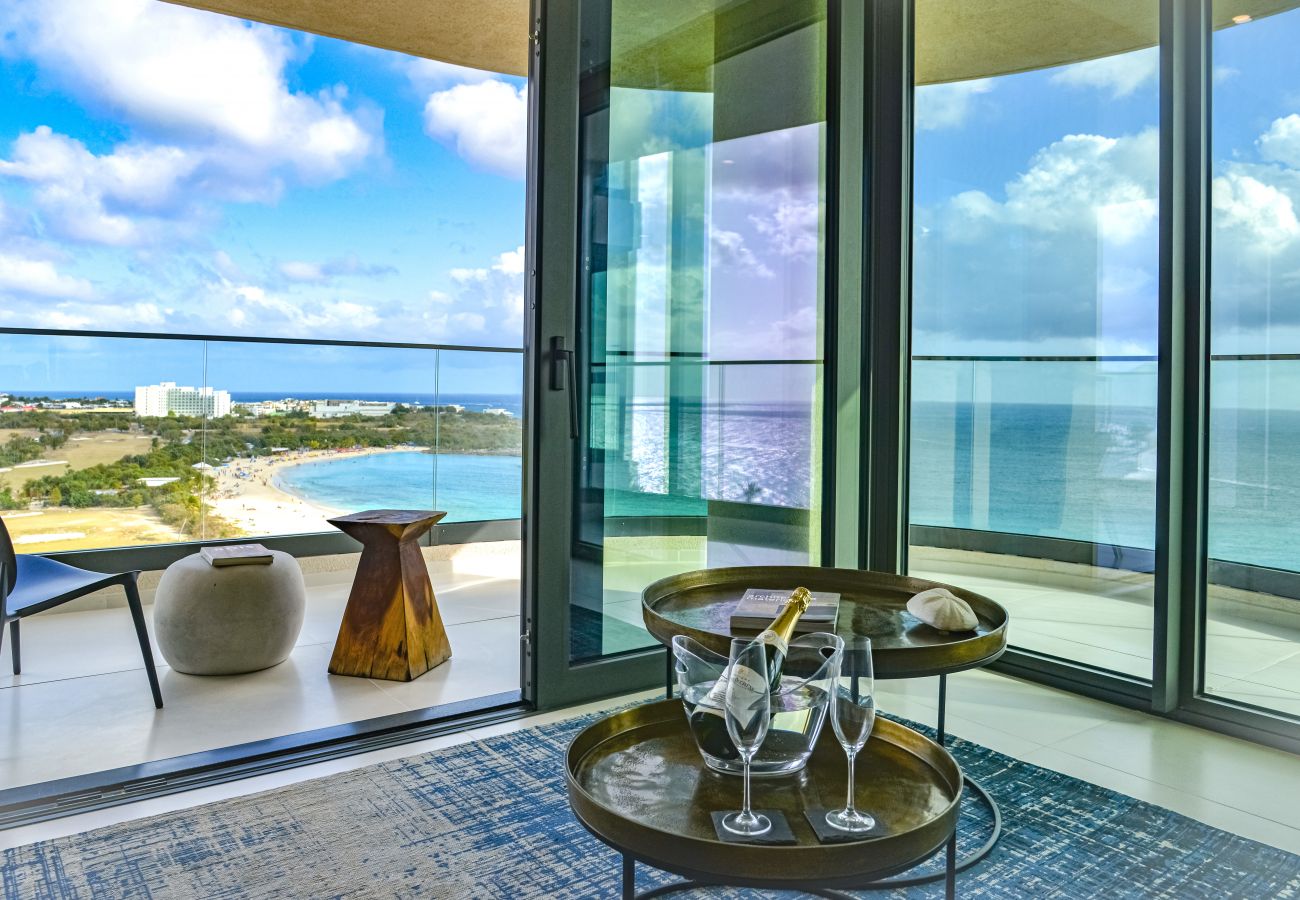 Sip a glass of champagne in front of the turquoise waters of Mullet Bay