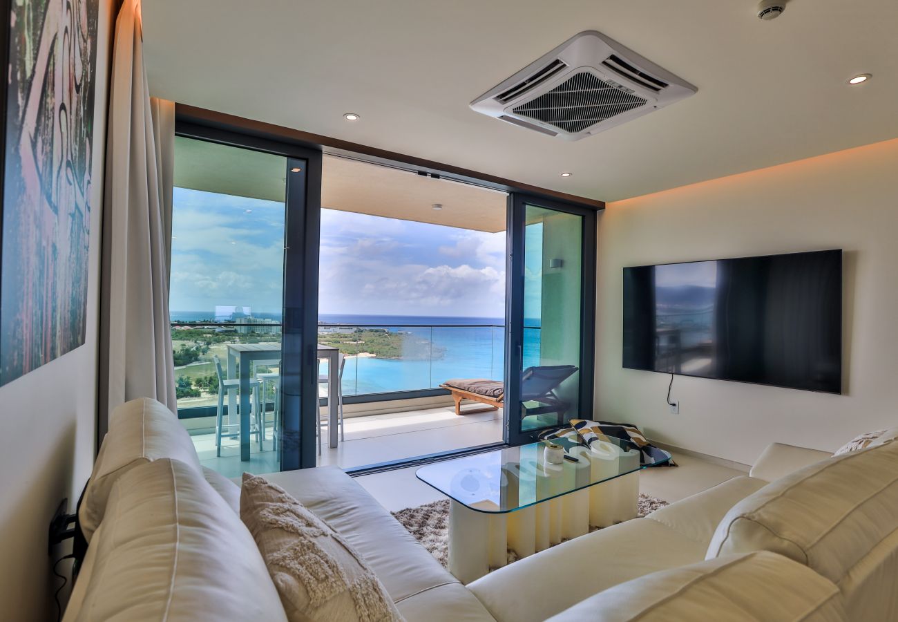 Big living room space with comfortable angled couch and flat screen tv 