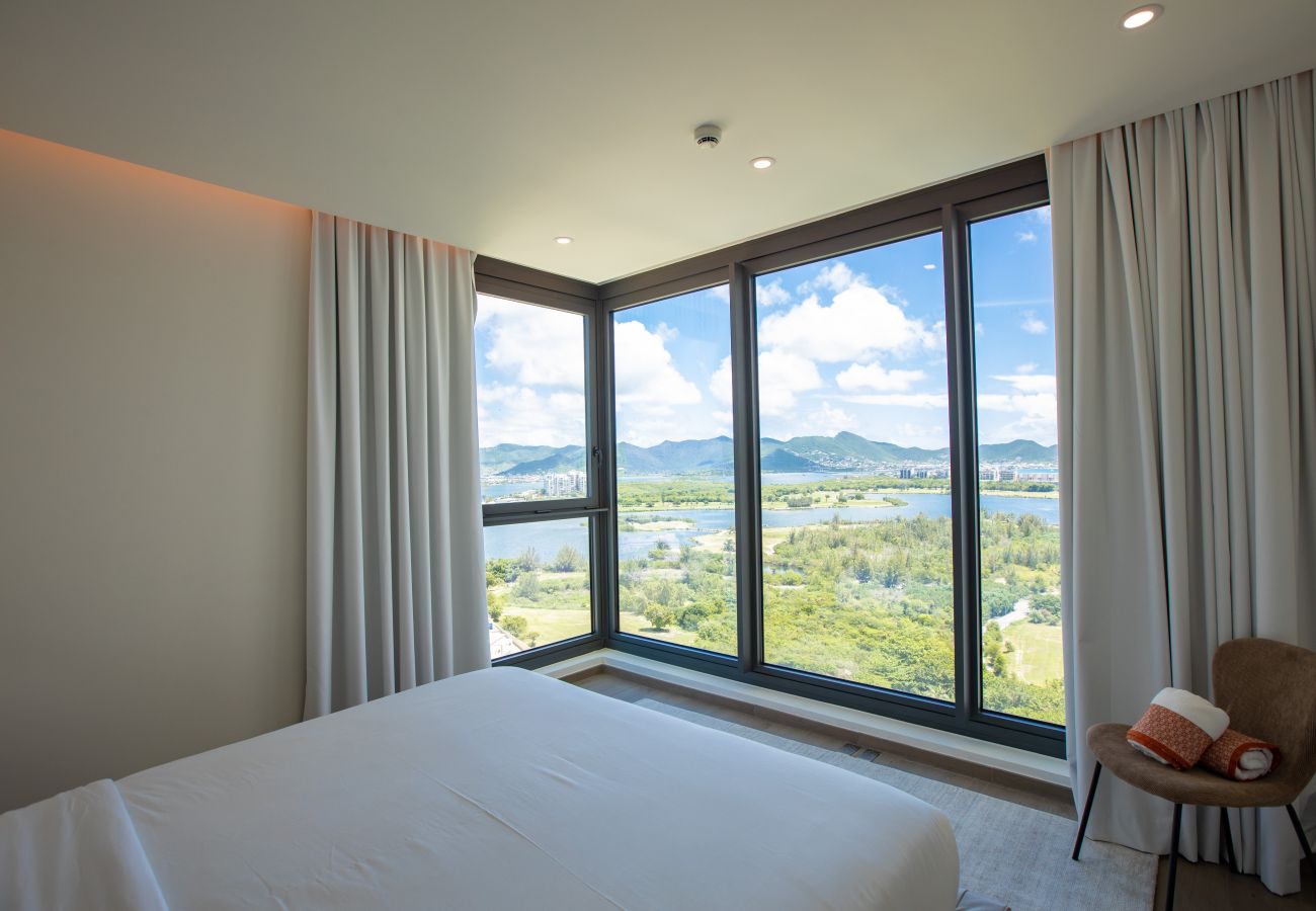 A modern and spacious bedroom with a beautiful view